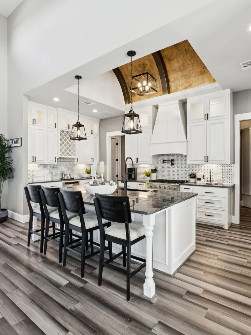 Barrel-vaulted wood ceiling over a custom kitchen — the craft standard carried through every Ark Industries build