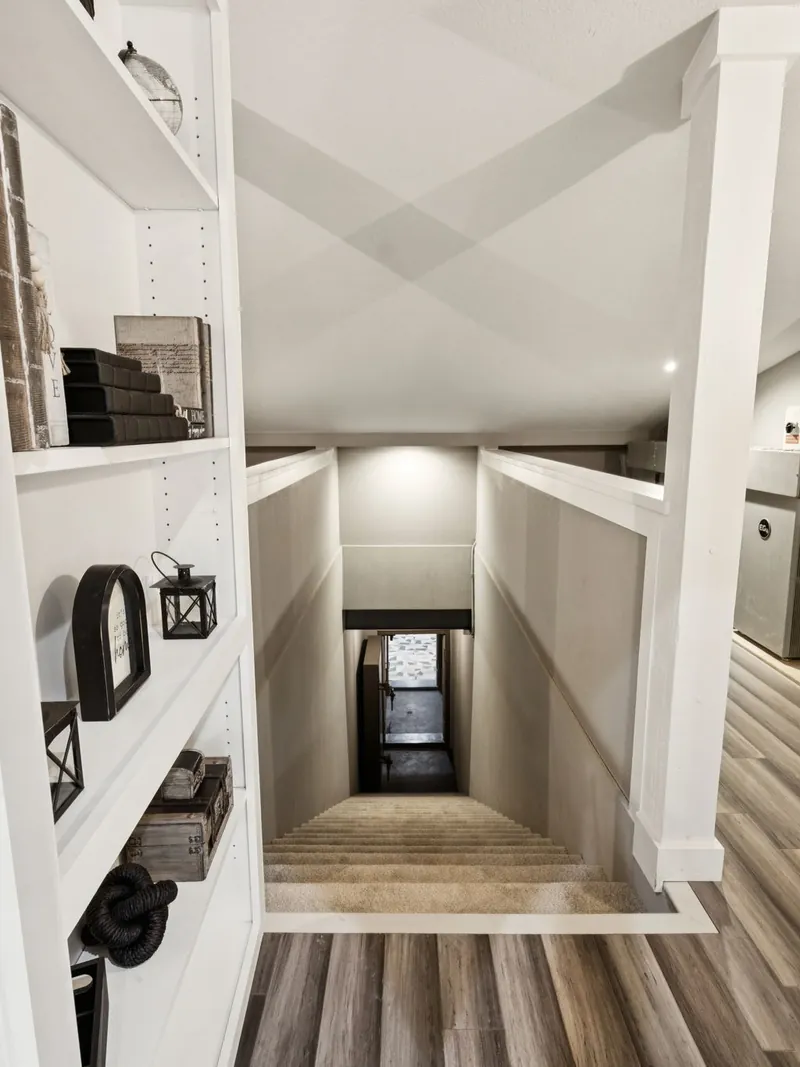 Hidden stair descending from the home to the finished shelter level