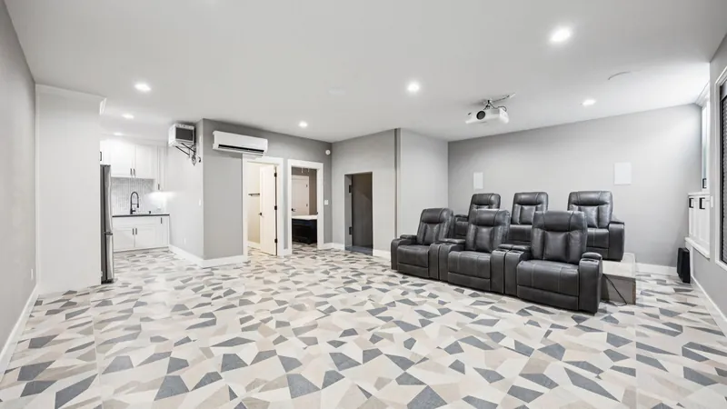 Finished underground shelter theater room with leather recliners